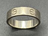 a close up of a ring on a table with a black background