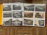 a book with a bunch of pictures on it sitting on a table