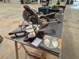 a picture of a table with a saw and other tools on it