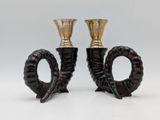 pair of black and gold candlesticks on a white background