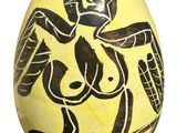 an image of a yellow and black painted egg with an image of a woman