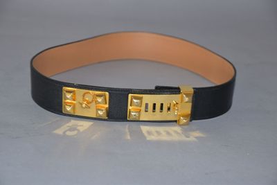 black leather belt with gold metal buckle and nameplates on it