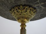 a close up of a table with a vase on it