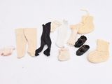 several pairs of socks, socks, socks, socks, and socks are laid out on a white surface