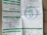 a close up of a receipt on a car seat with a barcode