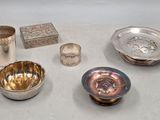 a lot of silver items that are on the table