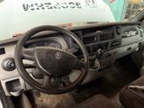 dashboard of a truck with a steering wheel and dashboard controls