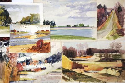 many paintings of watercolors on a table