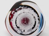 a close up of a glass object on a white surface