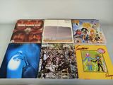 a lot of vinyl records on a glass table