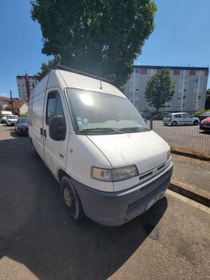 a white van that is parked on the side of the street