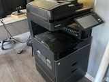 a photo of a printer sitting on top of a desk