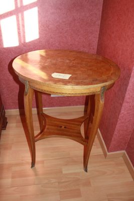 a wooden table with a wooden top on a hard wood floor