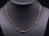 a gold beaded necklace on a mannequin mannequin mannequin mannequin mannequin mannequin mannequin mannequin mann