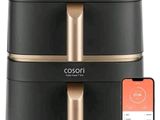 a black and gold air fryer sitting next to an iphone