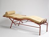 an image of a chaise with a roll of fabric on top of it