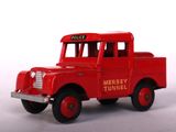 a red toy truck that is sitting on a white surface