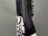 an image of a mannequin wearing a black and white dress