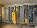 a room with a bunch of coats hanging on the wall