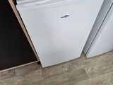 a white dishwasher and a black dishwasher in a kitchen
