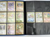 a lot of pokemon cards in a blue folder