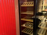 a wine cooler in the corner of a room