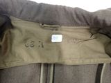 a close up of a jacket with a tag on it