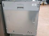 a refrigerator that is sitting on a pallet in a warehouse