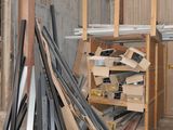 several pieces of wood are stacked on top of each other in a warehouse