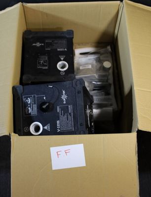boxes containing two different types of electronic devices are sitting on a table