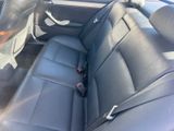 the interior of a car with black leather seats and a steering wheel