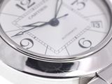 a close up of a wrist watch with a white dial