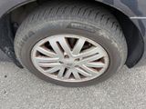 a car that has a flat tire on the street