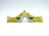 pair of yellow and blue bird salt and pepper shakers on a white background