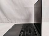 an open laptop computer sitting on top of a white table