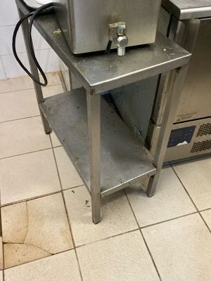 a machine that is sitting on a table in a kitchen