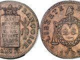 an old coin with a picture of a man on it