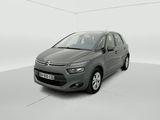 a grey citrole is parked in a white room