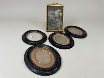 four black and gold picture frames with a picture of a man in a hat