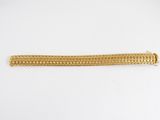 a gold chain bracelet with a clasp on a white background