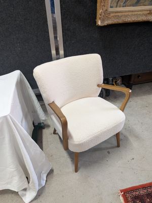 a white chair and a white table in a room