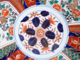 a decorative plate with a flower design on it