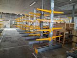 a large warehouse with lots of shelves and pallets