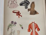 an open book with pictures of women ' s clothing and accessories
