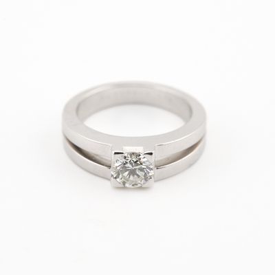 a white gold engagement ring with a princess cut diamond