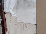 a cardboard box full of papers and papers on the floor