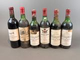 plusieurs bouteilles de vin sont alignées dans une rangée