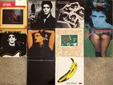 a lot of records on the floor with a banana on it