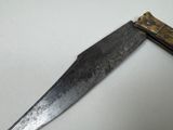a knife that is sitting on a table