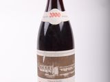 a bottle of wine that is sitting on a table